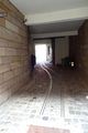 Hauseingang <!--LINK'" 0:91--> mit alten Rollwagengleise zum Warentransport für den ehemaligen Betrieb im Hinterhof, März 2020