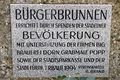2019: Gedenktafel von 1994 der Spender des [[Stadelner Bürgerbrunnen]], an der Friedhofsmauer angebracht