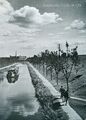 Ludwig-Donau-Main-Kanal mit Frachtkahn an der Stadtgrenze, Blick auf das Fabrikgebäude Soldan, Em-Eukal Werk, in Nürnberg, zw. 1935 - 1938