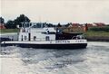 reger Schiffsverkehr auf den <a class="mw-selflink selflink">Main-Donau-Kanal</a> Höhe . Im Hintergrund die beiden Kamine der im Bau befindlichen , heutiger Standort der Firma  im August 1996